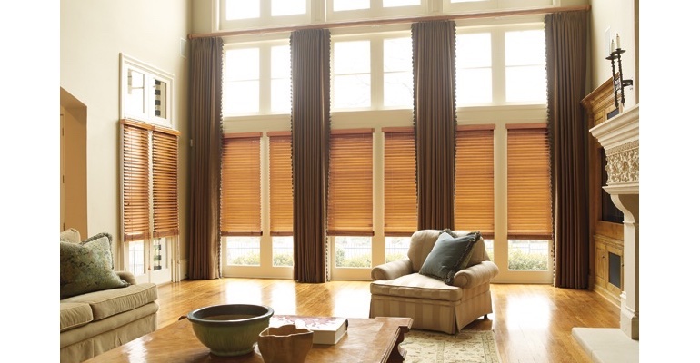 Phoenix great room with natural wood blinds and floor to ceiling drapes.
